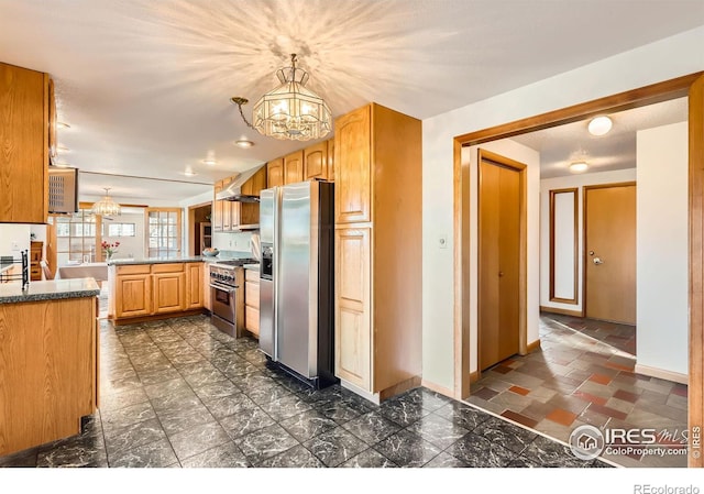 kitchen with kitchen peninsula, hanging light fixtures, stainless steel appliances, and a notable chandelier