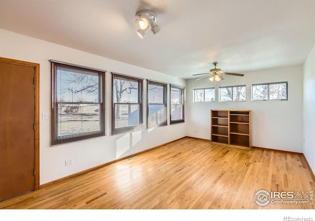 spare room with ceiling fan and light hardwood / wood-style flooring