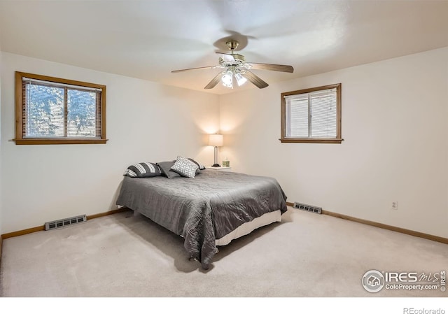 bedroom with ceiling fan and carpet