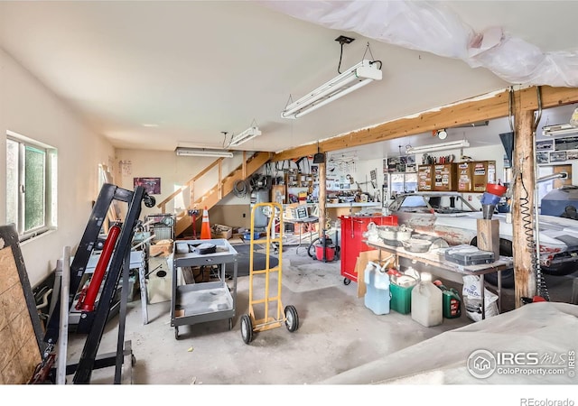 interior space with a workshop area and concrete floors