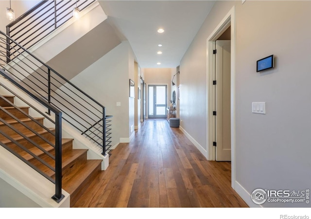 entryway with dark hardwood / wood-style floors