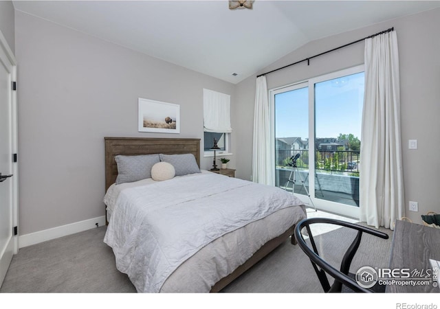 bedroom featuring light colored carpet, lofted ceiling, and access to outside