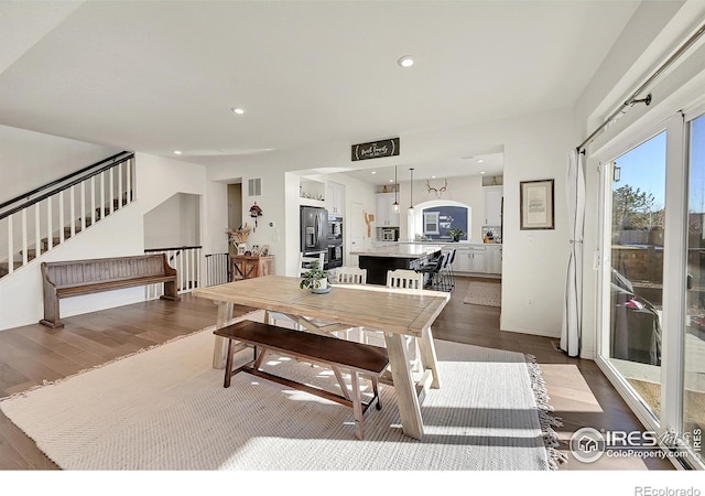 dining room with dark hardwood / wood-style floors