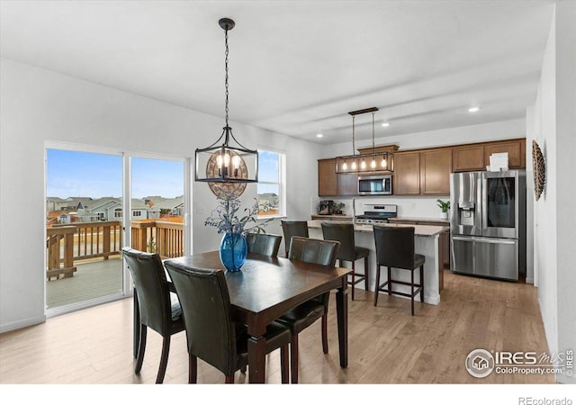 dining space featuring light hardwood / wood-style flooring