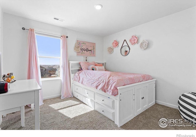 bedroom featuring light colored carpet