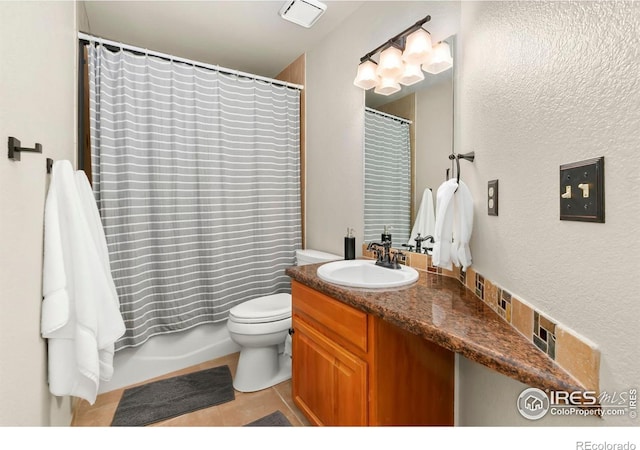 full bathroom with vanity, shower / bath combo, tile patterned floors, and toilet