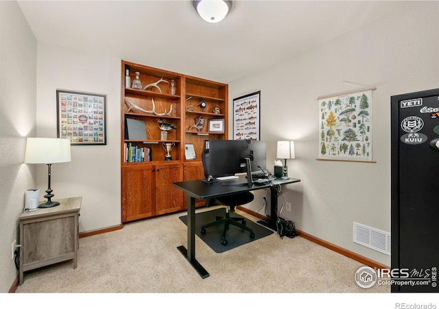 office space with light colored carpet