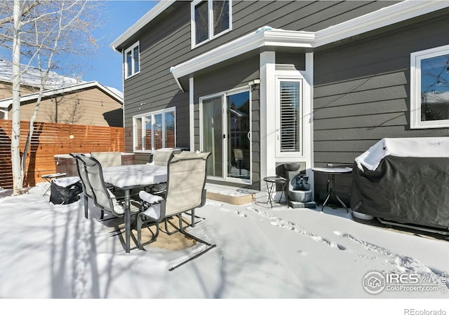 snow covered deck with area for grilling