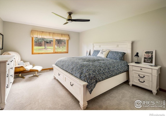 bedroom featuring ceiling fan and light colored carpet