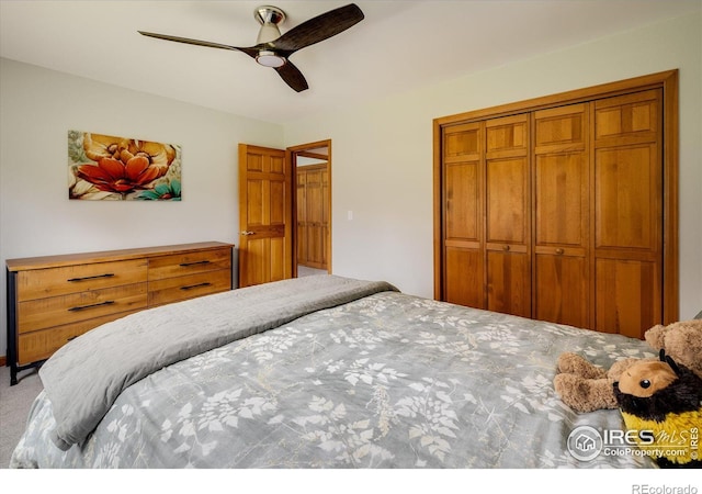 bedroom featuring carpet floors, a closet, and ceiling fan