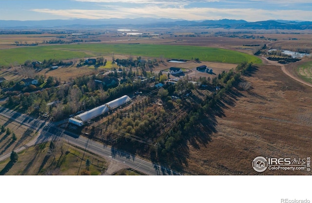 bird's eye view featuring a rural view and a mountain view