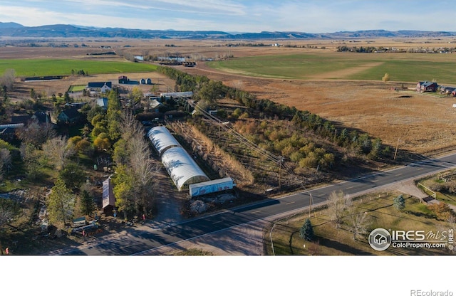 birds eye view of property featuring a rural view and a mountain view