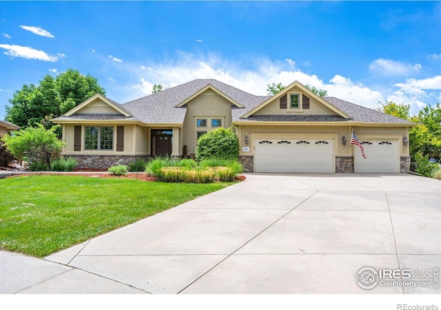 craftsman inspired home with a garage and a front yard