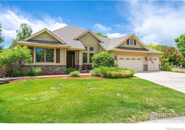 craftsman house with a front yard and a garage