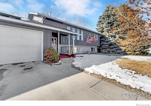 view of front of property with a garage and covered porch