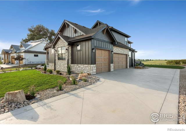 view of front of house featuring a garage and a front yard