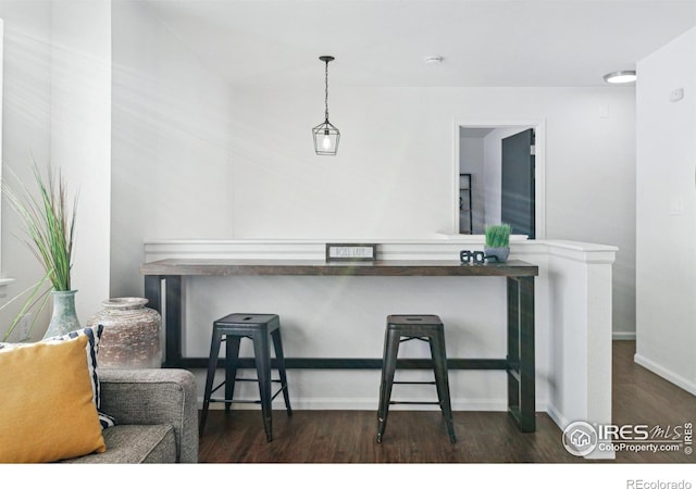 bar with wood finished floors and baseboards