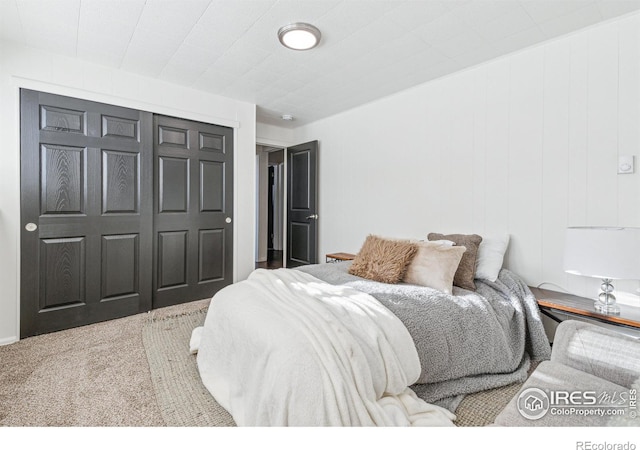 bedroom with carpet floors and a closet