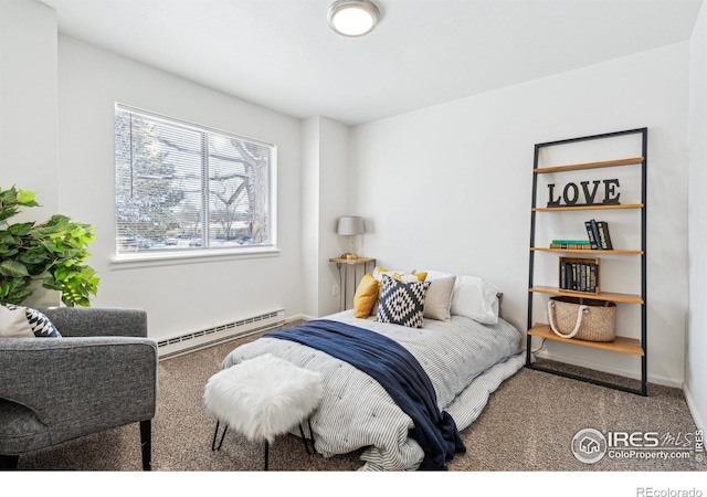 carpeted bedroom with a baseboard radiator and baseboards