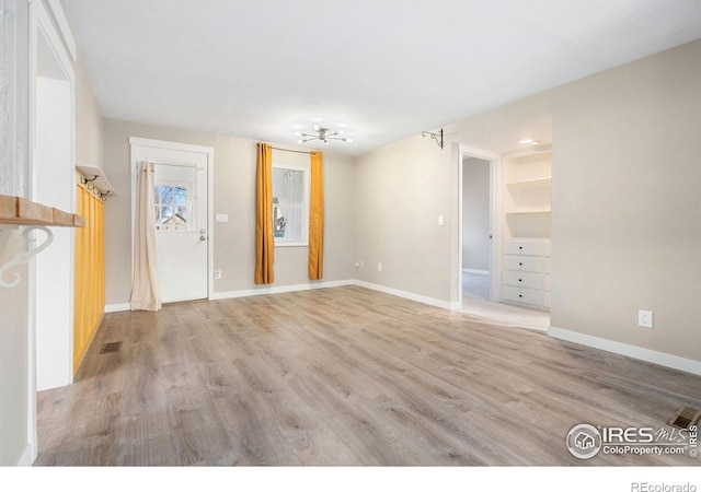 entrance foyer featuring light hardwood / wood-style floors