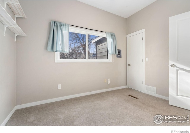 empty room with light colored carpet