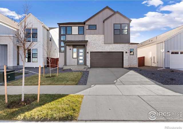 view of front of home featuring a garage and a front lawn