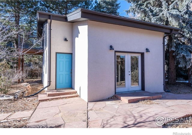 doorway to property featuring french doors