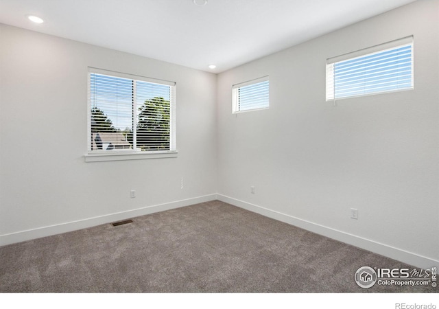 empty room featuring carpet floors