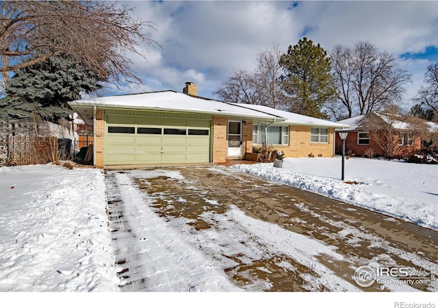 ranch-style home featuring a garage