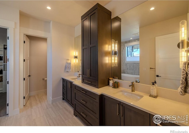 bathroom featuring a bathtub and vanity