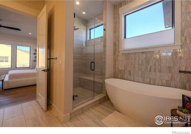 bathroom featuring plus walk in shower