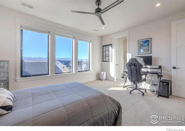 carpeted bedroom with ceiling fan