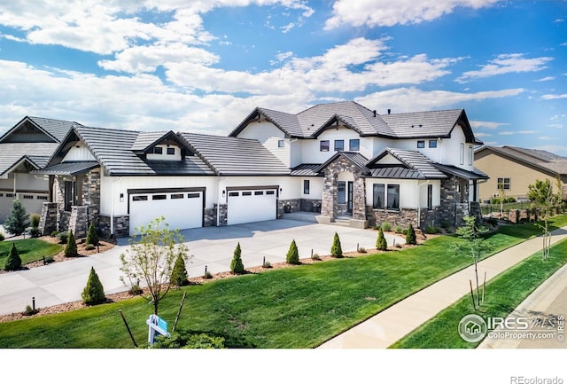 2294 Stonebrae Ct, Berthoud, CO 80513 - view of front of property with stone siding, driveway, and a garage