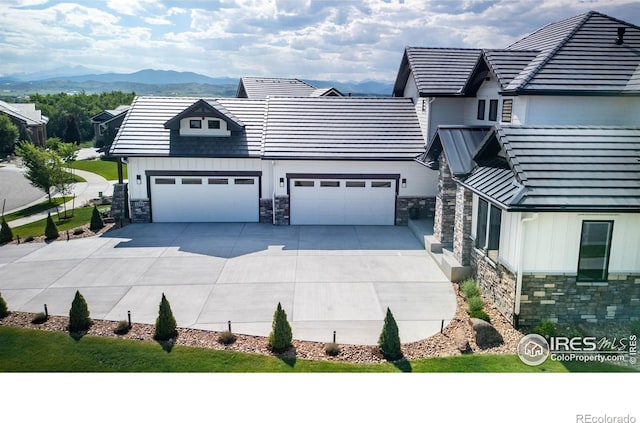 2294 Stonebrae Ct, Berthoud, CO 80513 - exterior space with stone siding, board and batten siding, concrete driveway, and a mountain view