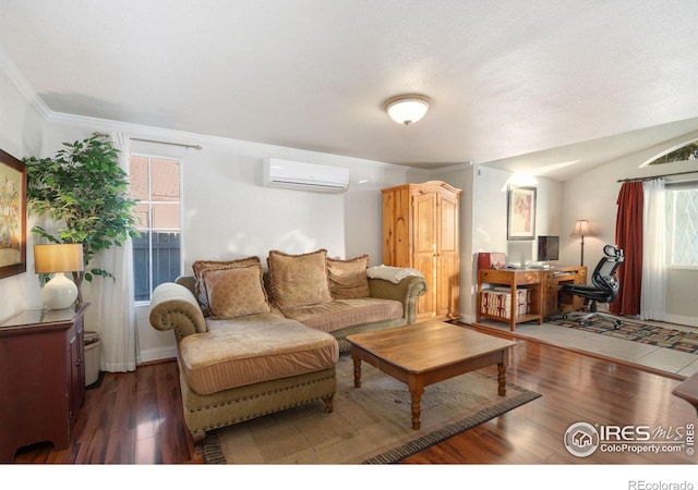 living room with dark wood-type flooring, ornamental molding, a wall mounted AC, and vaulted ceiling