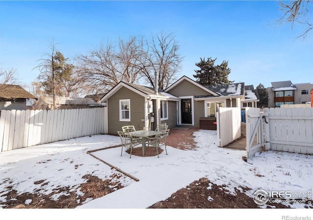 view of snow covered house