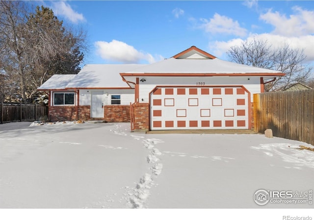 view of front of home with a garage