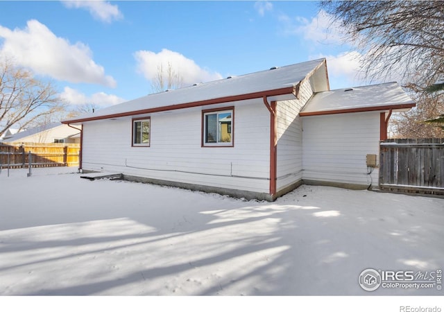 view of snow covered property