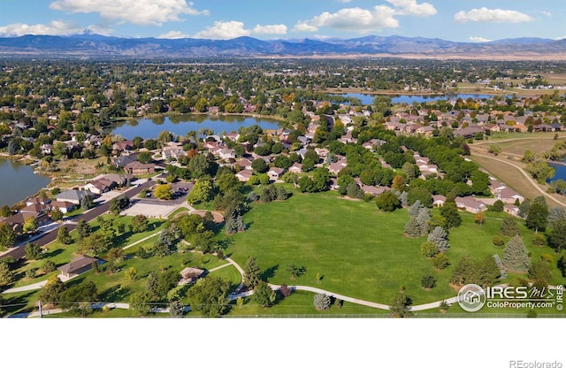 birds eye view of property featuring a water and mountain view