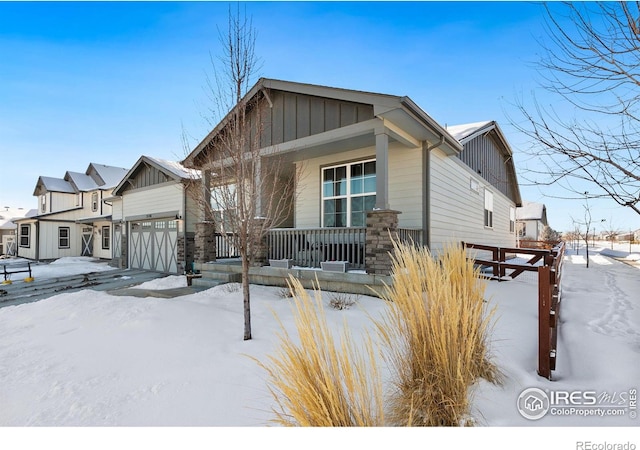 view of front of property featuring a garage and covered porch