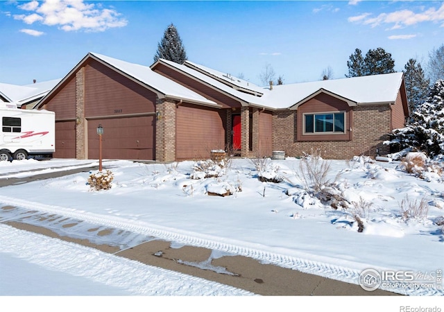 single story home featuring a garage