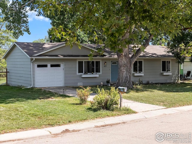 ranch-style house featuring a front yard and a garage