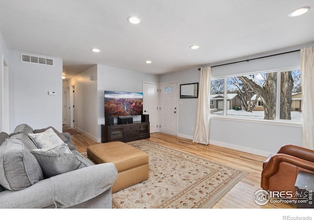 living room with light hardwood / wood-style floors