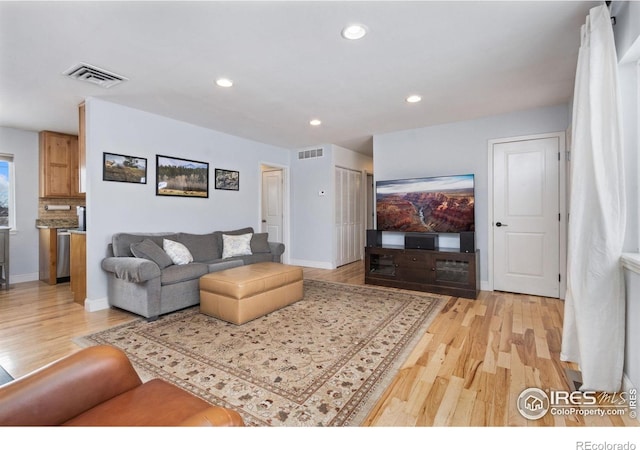 living room with light hardwood / wood-style floors