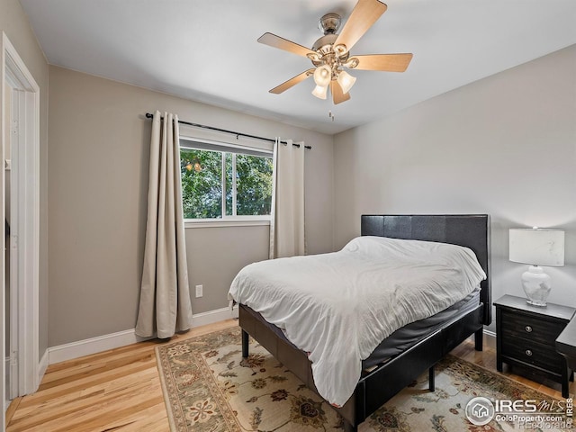 bedroom featuring light wood-type flooring and ceiling fan