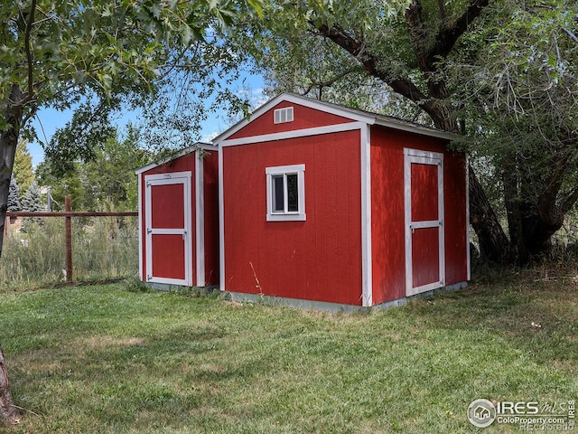 view of outdoor structure with a yard