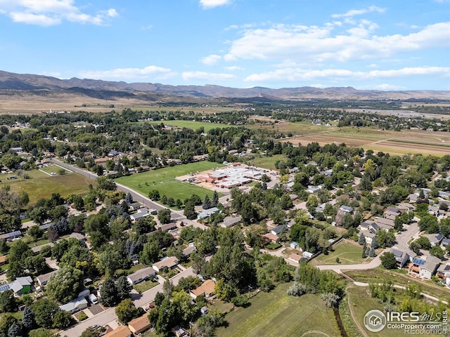 birds eye view of property featuring a mountain view