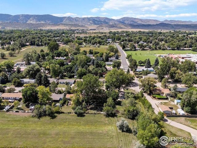 birds eye view of property with a mountain view