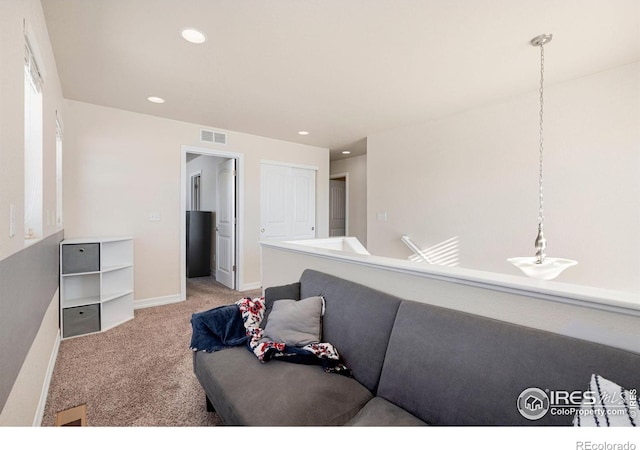 living room featuring light colored carpet