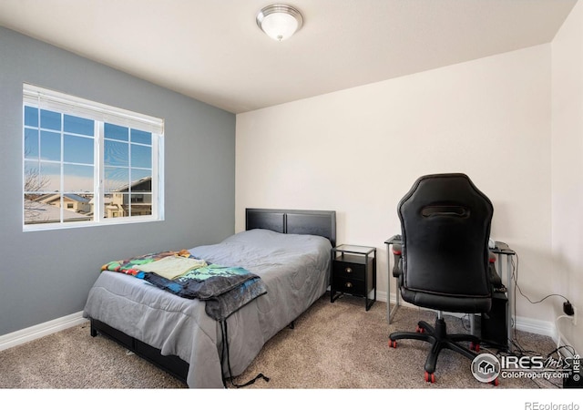 bedroom featuring light carpet